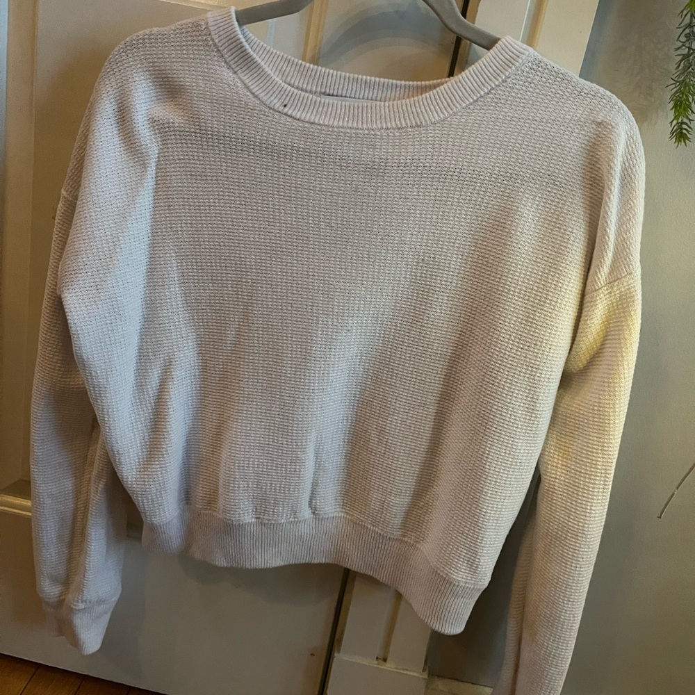 Comfortable Waffle sweater, sort of cropped. Size small but could fit M.not worn
